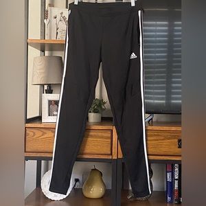 Women’s Adida’s Climacool Ankle Zip track pants with zip pockets.